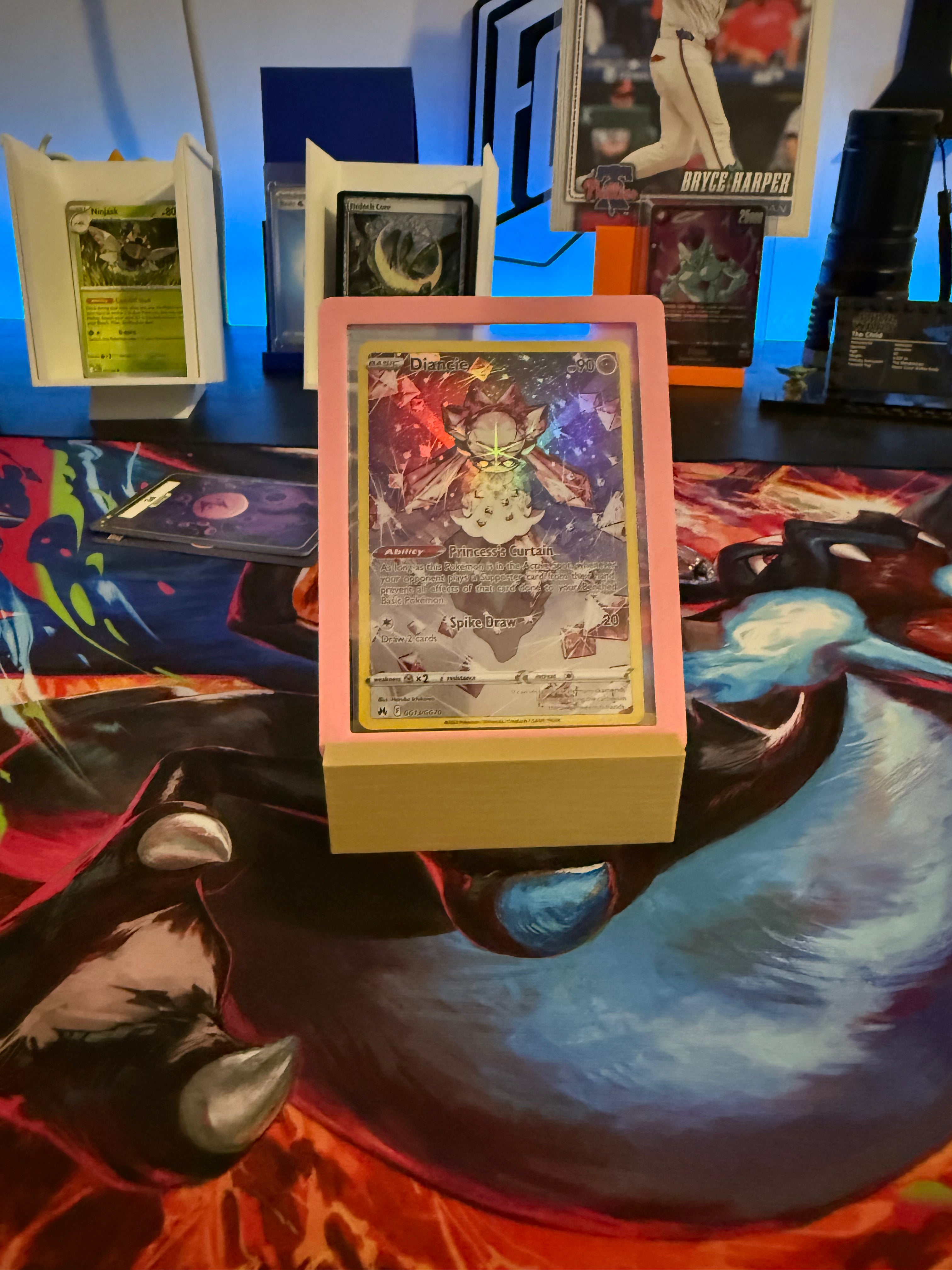 Card in a display case on a colorful table with other cards in the background