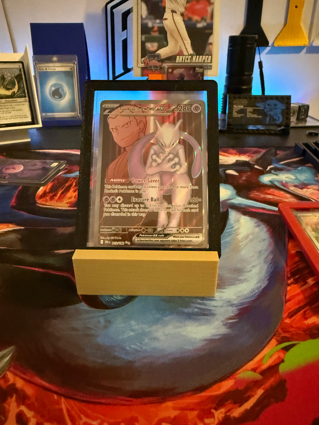 Trading card on a stand with a colorful background