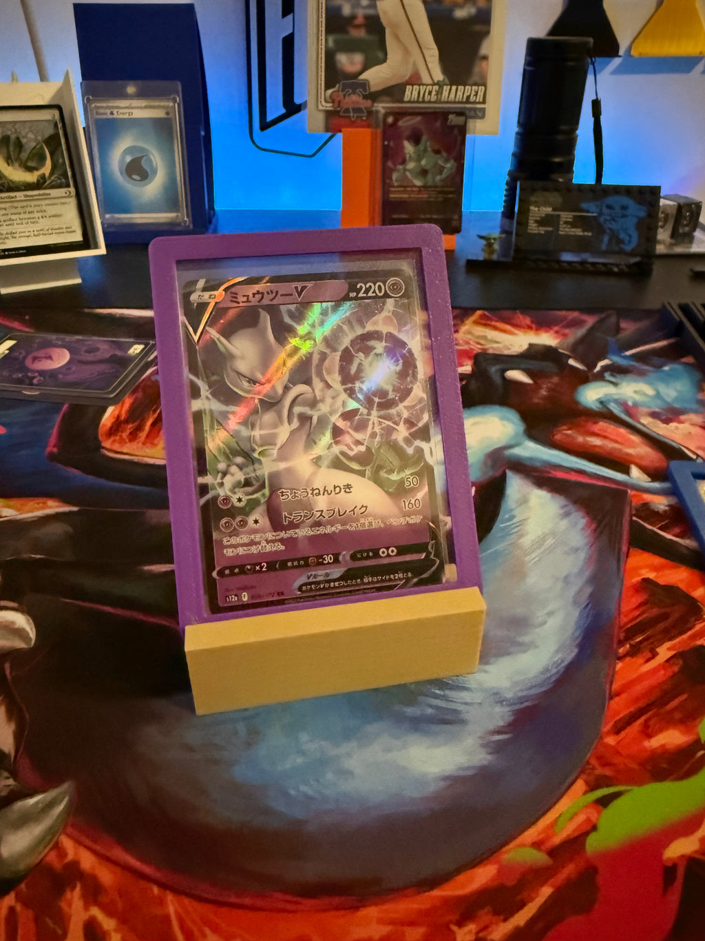 Card with a purple border on a colorful surface with other cards in the background